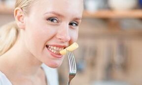 Girl eating pasta